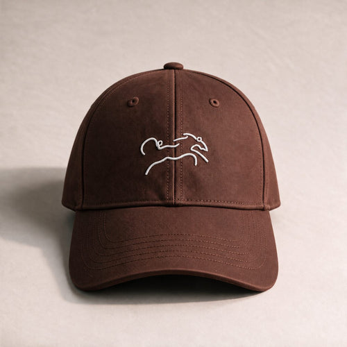 The Coco Cap, a chocolate brown baseball cap with a white embroidered horse logo.